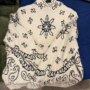 Elegant Cream and Black Patterned Turtleneck Sweater